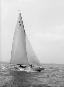 The 6 Metre sailing yacht Peterkin, 1914. Creator: Kirk & Sons of Cowes