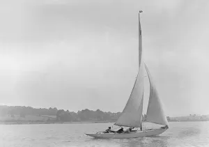 Reaching Prints: The 6 Metre sailing yacht Victoria (K5), 1921. Creator: Kirk & Sons of Cowes