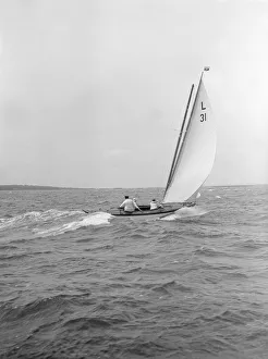 The 6 Metre Sandra sails downwind, 1913. Creator: Kirk & Sons of Cowes The 6 Metre Sandra sails downwind, 1913. Creator: Kirk & Sons of Cowes