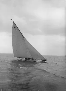 The 6 Metre Scotia IV heeling on upwind leg, 1913. Creator: Kirk & Sons of Cowes