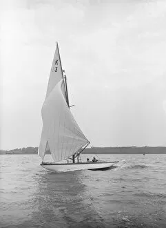 Bermuda Rig Collection: The 7 Metre Ancora (K3) sailing under spinnaker, 1913. Creator: Kirk & Sons of Cowes