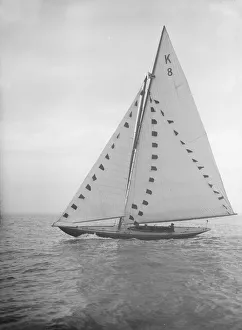 The 7 Metre sailing yacht Pinaster (K8) with prize flags, 1912