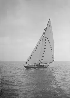 The 7 Metre sailing yacht Pinaster (K8) with prize flags, 1912