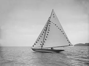 The 7 Metre sailing yacht Pinaster (K8) with prize flags, 1912