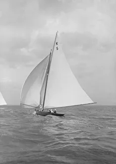 The 7 Metre yacht Strathendrick (K5) sailing with spinnaker, 1914
