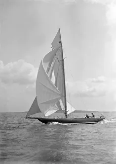 Endrick Prints: The 8 Metre Endrick sailing downwind under spinnaker, 1911. Creator: Kirk & Sons of Cowes