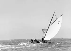 The 8 Metre sailing yacht Dilkusha setting spinnaker, 1911. Creator: Kirk & Sons of Cowes