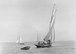 The 9 ton auxilary cutter Grayling with tender, 1921. Creator: Kirk & Sons of Cowes