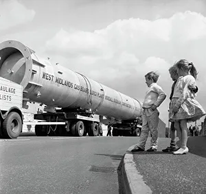 An absorption tower being transported by road, Dukenfield, Manchester, 1962. Artist