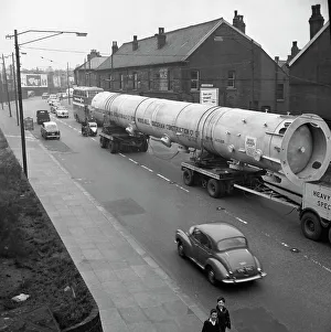 An absorption tower being transported by road, Dukenfield, Manchester, 1962. Artist