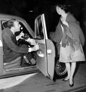 Movie Prints: Actor Bernard Bresslaw in Standard Vanguard at 1960 Motor Show. Creator: Unknown