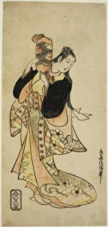 Orange Colour Gallery: The Actor Ichikawa Monnosuke I as Oiso no Tora in the play 'Nigiwai Suehiro Soga, 'perf... c. 1721