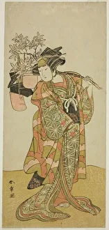 The Actor Yamashita Kinsaku II as Odai, an Eboshi (Hat) Seller, in the Play Hana-zumo... c. 1775. Creator: Shunsho
