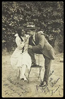 Variety Show Prints: Two actors, one in drag, pose on garden furniture, 1918. Creator: Unknown
