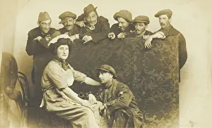 Crouching Prints: Actors gathered around a man in drag, between 1910 and 1919. Creator: Unknown