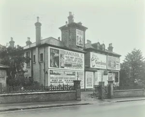Granada Prints: Advertising hoardings on the wall of a building, Wandsworth, London, 1938