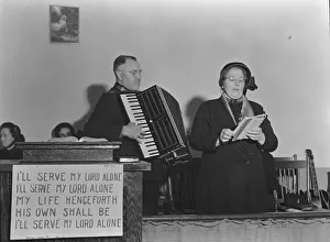 Accordionist Gallery: Adjutant and his wife sing, Salvation Army, San Francisco, California, 1939. Creator: Dorothea Lange