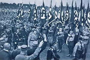 Adolf Hitler Collection: Adolf Hitler, escorted by SS leaders, inspects the SA at a Nazi rally in Nuremberg, 1933