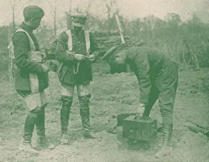 Aerial photographers fixing on parachute harnesses before making an ascent, c1917 (1919) Aerial photographers fixing on parachute harnesses before making an ascent, c1917 (1919)