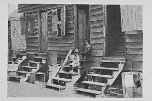 Jean Blackwell Hutson Division Prints: African American children sitting on the stairs in front of their house