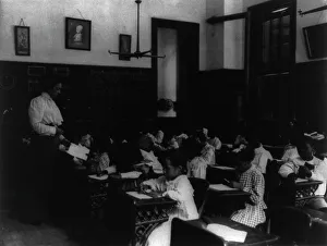African American school children at work on a craft project, (1899?). Creator: Frances Benjamin Johnston