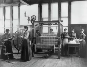 Training College Prints: African-American women weaving rug in home economics class at Hampton Institute
