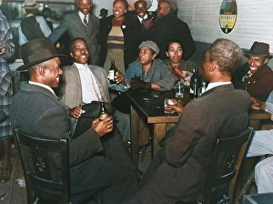 Post Prints: African Americans conversing and drinking beers in a bar