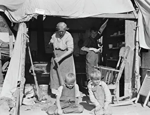 Refugee Camp Prints: Aged woman with three of her twenty-two grandchildren