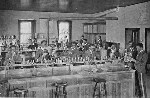 Booker T Prints: In the agricultural laboratory, 1904. Creator: Frances Benjamin Johnston