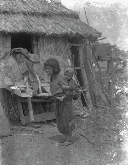 Young Girl Prints: Ainu child carrying a baby on back, 1908. Creator: Arnold Genthe