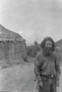 Ainu man standing outside, 1908. Creator: Arnold Genthe