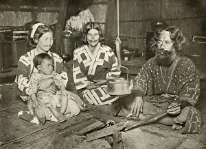 In Lotus Land Japan Prints: Ainu Man and Women at Home, 1910. Creator: Herbert Ponting