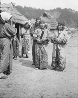Ainu woman outside in the village lane, 1908. Creator: Arnold Genthe