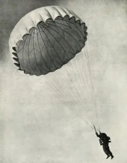 Stewart Oliver Prints: Airman using a parachute during the Second World War, 1941. Creator: Charles Brown