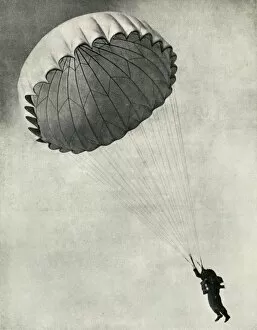 Airman using a parachute during the Second World War, 1941. Creator: Charles Brown