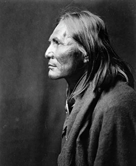 American Indian Collection: Alchise, Apache Indian, half-length portrait, left profile, c1906. Creator: Edward Sheriff Curtis