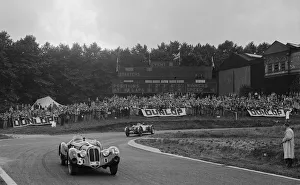 Advertising Hoarding Gallery: Alfa Romeo of Hugh Hunter leading a Riley at Crystal Palace, London, 1939. Artist: Bill Brunell