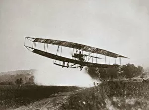 Edwin Gallery: American aviator Glenn Curtiss making the first heavier-than-air flight in his June Bug, 1908