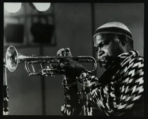 American trumpeter Ted Curson playing at the Bracknell Jazz Festival, Berkshire, 1983 American trumpeter Ted Curson playing at the Bracknell Jazz Festival, Berkshire, 1983