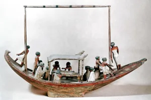 Ancient Egyptian model of a boat carrying a mummy to its tomb Ancient Egyptian model of a boat carrying a mummy to its tomb