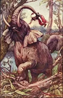 The animal took me up with his trunk, and placed me on his shoulders, c1930. Creator: Frank C