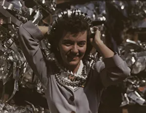 Annette del Sur publicizing salvage campaign... Douglas Aircraft Company, Long Beach, Calif. 1942. Creator: Alfred T Palmer
