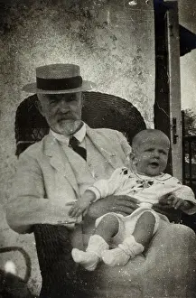 Straw Boater Prints: Anton Freiherr von Eiselsberg with a baby. Creator: Unknown