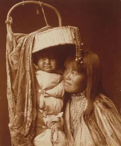 Apache Prints: Apache girl and papoose, c1903. Creator: Edward Sheriff Curtis