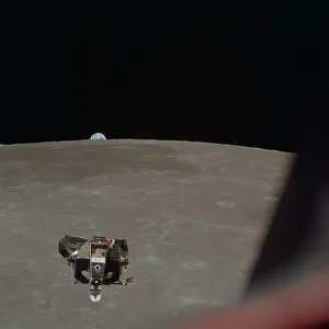 Crater Prints: Apollo 11 Lunar Module ascent stage photographed from Command Module, July 21, 1969