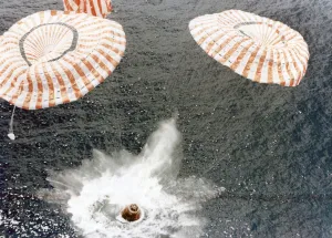 Splashdown Prints: The Apollo 15 capsule lands safely despite a parachute failure