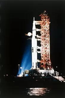 John F Kennedy Space Center Collection: Apollo 9 Saturn V rocket with full moon, 1969. Creator: NASA