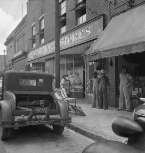 Appliqued embroideries for sale on street in front of ten cent... Siler City, North Carolina, 1939 Appliqued embroideries for sale on street in front of ten cent... Siler City, North Carolina, 1939