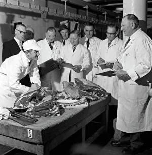 Apprentice butcher showing his work to competition judges, Barnsley, South Yorkshire, 1963