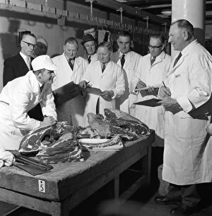 Barnsley Gallery: Apprentice butcher showing his work to competition judges, Barnsley, South Yorkshire, 1963